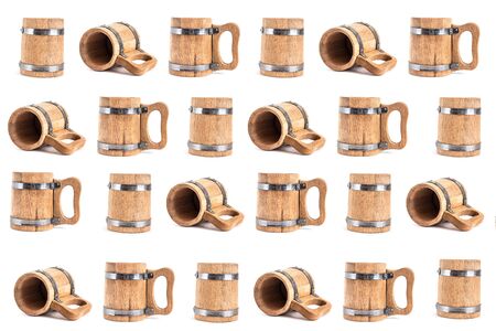 pattern of many wooden beer mugs in different angles on a white background.の写真素材