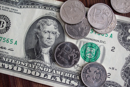 Two-dollar paper banknote with rubles scattered on top.の写真素材