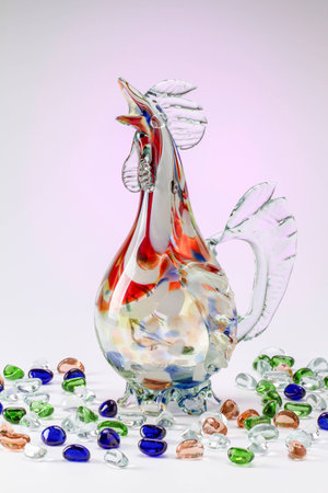 CarafCocktail glass with colored stones on a light backgrounde of a cock with stonesの写真素材