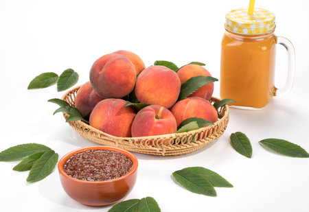 Peaches fresh new crop with leaves with juice on the tableの写真素材