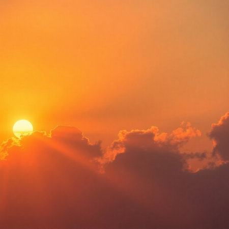 Beautiful sunset sky with clouds and sun rays. Nature background.の素材