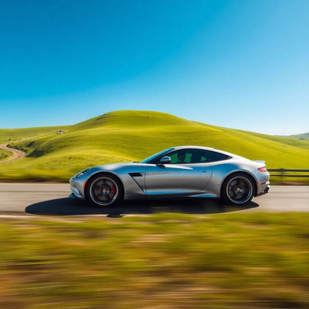 View of a classic sports car in motion on a mountain road.の素材