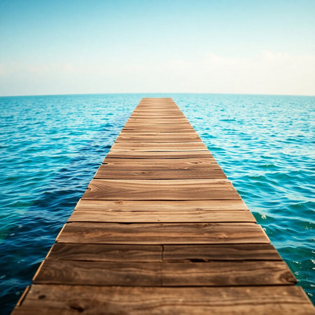 Wooden pier in the sea on a background of blue sky.の素材