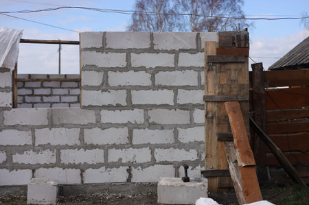 White brick wall in the construction site. Construction of a house.