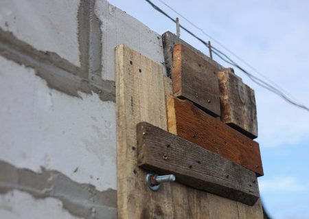 Wooden boards on a construction site against the background of the skyの写真素材