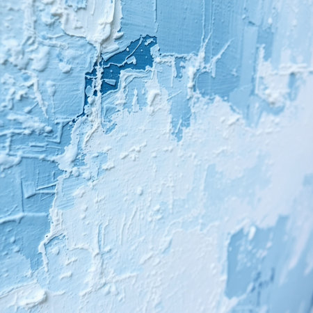 White paint on a blue wall as an abstract background. Texture.の素材
