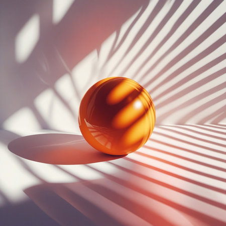 3d render of orange ball on white background with shadows and sunlightの素材