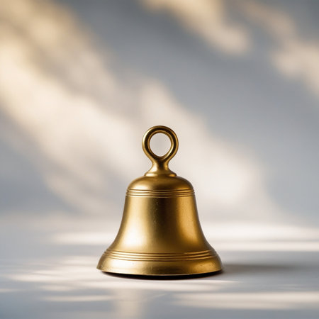 Golden bell on a white background with shadow. 3d rendering.の素材