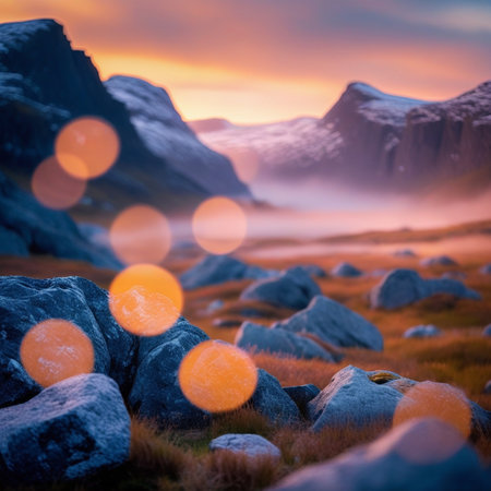 Beautiful mountain landscape with snow covered rocks at sunset. Dramatic sky.の素材