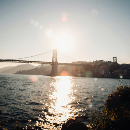 Lisbon cityscape at sunset with famous 25th of April Bridge, Portugalの素材