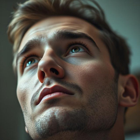 Close-up portrait of a handsome young man looking up and thinking.の素材