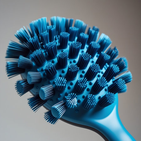 Blue plastic brush for cleaning hair on a gray background. 3d renderingの素材