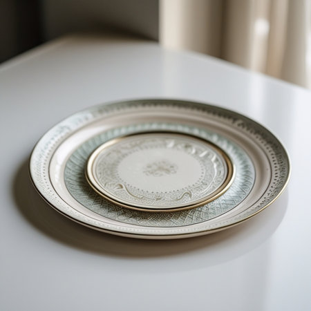 Vintage porcelain plate on white table. Selective focus.の素材