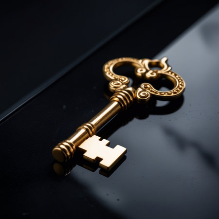 Golden key on a black background. Shallow depth of field.の素材