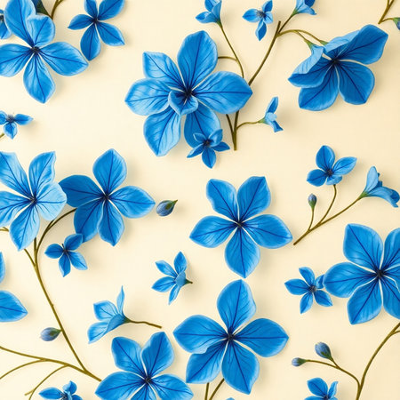 Flowers composition. Pattern made of blue flowers on yellow background. Flat lay, top viewの素材
