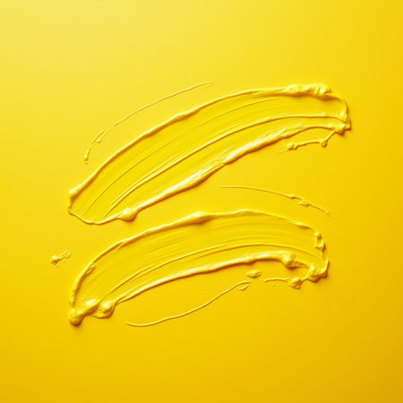 close up of a smudged cosmetic product on yellow backgroundの素材