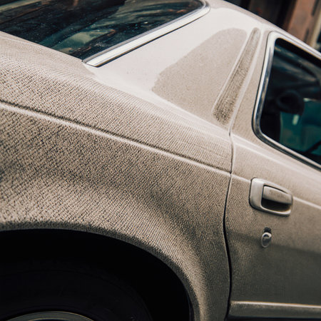 Detail of a gray car parked on the street. Selective focus.の素材