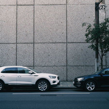 Car parking on the street in front of a wall. Urban scene.の素材