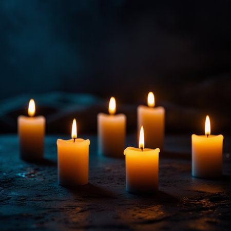 Burning candles on a dark background. Shallow depth of field.の素材
