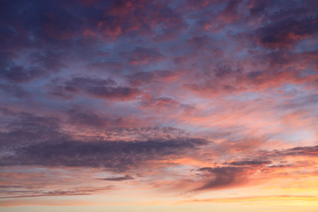 Cloudscape, Colored Clouds at Sunset near the Ocean as a Background