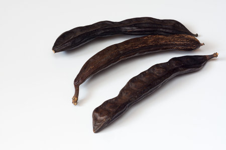 carob fruit pods on a white background isolated