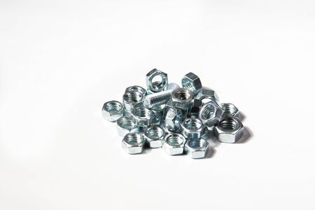 bolts nuts hardware on a white background isolatedの写真素材