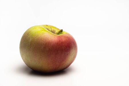 A ripe Apple shot from the side on a white backgroundの写真素材