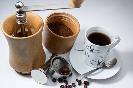 manual coffee grinder ground filter press and Cup of coffee and coffee beansの写真素材