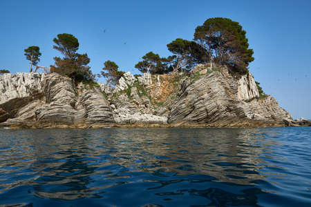Small stone island in the sea near Petrovacの写真素材