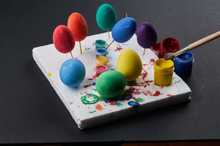 easter eggs are natural and artificial in different colors.creativity with children, traditional symbolsの写真素材