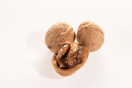 walnut whole and split isolated on a white background with a close upの写真素材