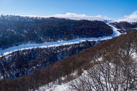 Ski trail in the mountains on a sunny dayの写真素材