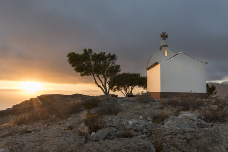 Chapel on a hill at sunriseの写真素材