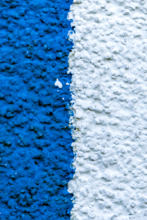 Detail of a white blue plaster on a village houseの写真素材