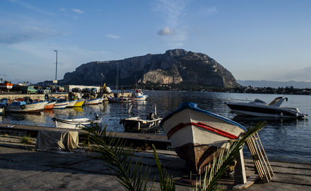 colorful fishing boats lit by the setting sun on the shores of Sicilyのeditorial素材