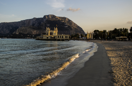 An ancient sea bath illuminated by the setting sun on the shores of Sicilyの写真素材