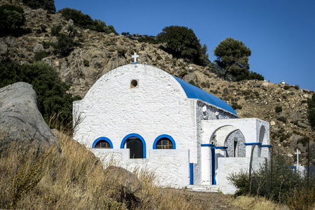 and a small white Greek chapel in the inland mountains on the island of Kosの写真素材