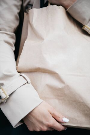 Craft package in the hands of a girlの写真素材