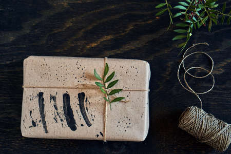 Gift box minimalism. Black and green. DIY Christmas packaging.の写真素材