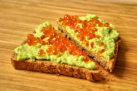 Red caviar avocado sandwich for healthy snack. Proper nutrition. Delicious food.の写真素材