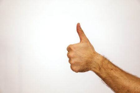 Caucasian man thumbs up. Class by hand. It turns out great and super.