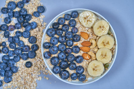A healthy mix of Granule and muesli. Ready breakfast of banana in dry porridgeの写真素材