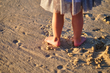 Little girl footprints on the sand.の写真素材