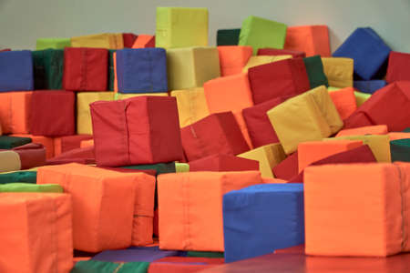 Multi-colored gymnastic sponge cube. Colorful baby cubes. Sports Equipment.の写真素材
