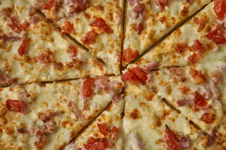 Pizza assorted pepperoni in box and on white plate. Hot with cheese and seafood.の写真素材