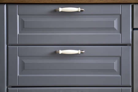 Doors with handles. Blue, white, grey. Wardrobe in the apartment. Style. MAcro.の写真素材