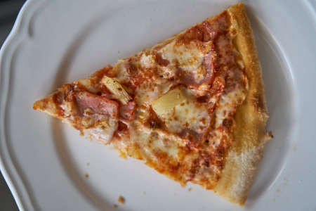 Pizza assorted pepperoni in box and on white plate. Hot with cheese and seafood.の写真素材