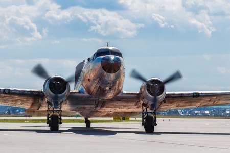 Dakota Douglas C 47 transport old plane boarded on the runway summerの写真素材