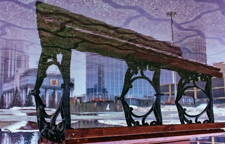 bench in puddle reflection Yekaterinburg downtown upside downの写真素材