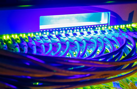 Network switch and UTP ethernet cables close-up in  server room